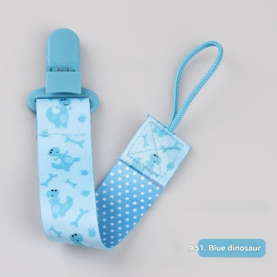 attache tetine dinosaure bleu