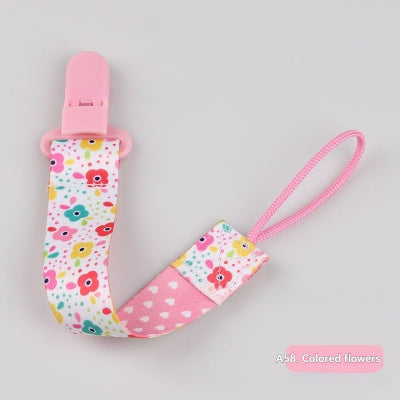 attache tetine fleur colorees