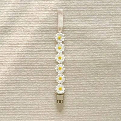 attache tetine jaune blanc