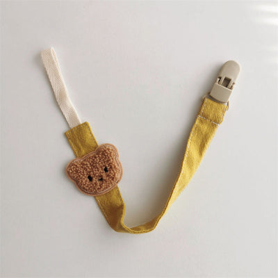 attache tetine jaune