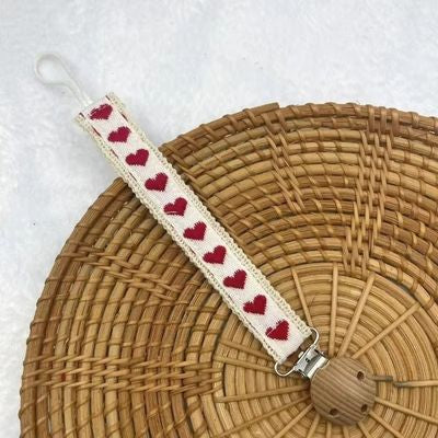 attache tetine rouge