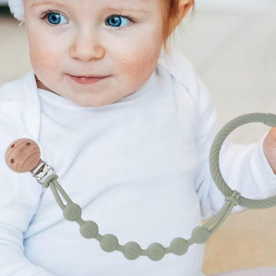 attache tetine systeme de fixation securise 