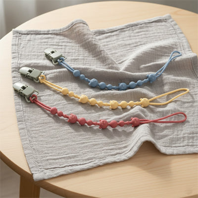 attache tetines plusieurs coloris