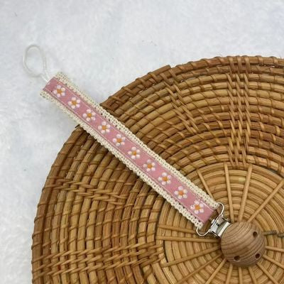 attache tetines rose