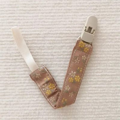 attaches tetine jaune