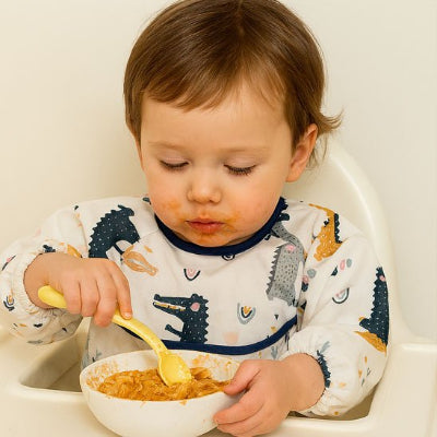 bavoir bebe fermeture ajustable au col